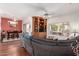 Comfortable living room with hardwood floors, a built-in bookcase, and a view of the patio at 16331 W Tierra Way, Surprise, AZ 85374