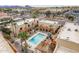 Aerial view of community highlighting pool, mature landscaping, and desert surroundings at 16336 E Palisades Blvd # 7, Fountain Hills, AZ 85268