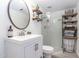 Bright bathroom with a modern vanity, decorative shelves, and a glass-enclosed shower at 16336 E Palisades Blvd # 7, Fountain Hills, AZ 85268