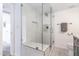 Updated bathroom featuring a glass shower, built-in seat and neutral tiling at 16336 E Palisades Blvd # 7, Fountain Hills, AZ 85268