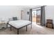 Minimalist bedroom with a sliding glass door leading to an outdoor space at 16336 E Palisades Blvd # 7, Fountain Hills, AZ 85268