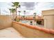 Relaxing courtyard view includes a pool, a pergola and lots of beautiful desert landscaping at 16336 E Palisades Blvd # 7, Fountain Hills, AZ 85268