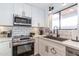 Updated kitchen showcases sleek appliances, white countertops, and modern fixtures at 16336 E Palisades Blvd # 7, Fountain Hills, AZ 85268