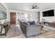 Inviting living room features stylish decor, modern ceiling fan, and neutral paint tones at 16336 E Palisades Blvd # 7, Fountain Hills, AZ 85268