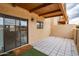 Private outdoor patio with tiled flooring and covered ceiling offering a welcome mat at 16336 E Palisades Blvd # 7, Fountain Hills, AZ 85268