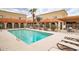 Sparkling community pool surrounded by lush desert landscaping and comfortable lounge chairs at 16336 E Palisades Blvd # 7, Fountain Hills, AZ 85268