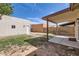 Spacious backyard with a covered patio area, perfect for outdoor entertaining and relaxation at 16513 N 68Th Dr, Peoria, AZ 85382