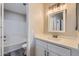 Clean bathroom featuring a shower-tub combo, modern vanity, and neutral tones at 16513 N 68Th Dr, Peoria, AZ 85382