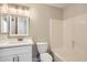 Bright bathroom featuring a tub-shower combination and a modern vanity with storage at 16513 N 68Th Dr, Peoria, AZ 85382