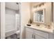 Well-lit bathroom featuring a shower/tub combo and a vanity with ample storage space at 16513 N 68Th Dr, Peoria, AZ 85382