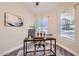 Cozy home office space with natural light, neutral walls, and wood-look flooring at 16513 N 68Th Dr, Peoria, AZ 85382