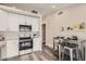 Updated kitchen with white cabinets, stainless steel appliances, and an eat-in dining area at 16513 N 68Th Dr, Peoria, AZ 85382