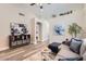 Comfortable living room features modern decor, neutral walls, and wood-look flooring at 16513 N 68Th Dr, Peoria, AZ 85382