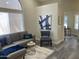 Comfortable gray sofa, stylish chair and chic decor in this well-lit living area at 16513 N 68Th Dr, Peoria, AZ 85382