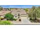 Residential home featuring a clean roof, well-maintained yard, and classic architecture in a neighborhood setting at 1694 E Mia Ln, Gilbert, AZ 85298