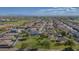 An aerial view shows a well-planned residential community with green spaces, schools and easy access to local amenities at 1694 E Mia Ln, Gilbert, AZ 85298