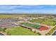 Aerial shot of the local high school athletic facilities with football field, baseball diamond and tennis courts at 1694 E Mia Ln, Gilbert, AZ 85298