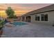 Well-maintained backyard with a pool, patio, and lush landscaping; perfect for outdoor living at 1694 E Mia Ln, Gilbert, AZ 85298