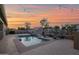 Inviting backyard pool with lounge chairs and string lights, perfect for relaxing evenings at 1694 E Mia Ln, Gilbert, AZ 85298
