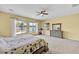 Spacious bedroom with three large windows providing great natural light and a view of the pool at 1694 E Mia Ln, Gilbert, AZ 85298
