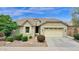 Well-kept single-Gathering home with tidy landscaping, a two-car garage, and inviting front entrance at 1694 E Mia Ln, Gilbert, AZ 85298