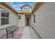 Inviting front entrance with a cozy bench and a well-maintained walkway to the front door at 1694 E Mia Ln, Gilbert, AZ 85298