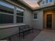 Inviting front porch area with bench seating and stylish windows, perfect for relaxing outdoors at 1694 E Mia Ln, Gilbert, AZ 85298