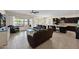 Open-concept living room features tile flooring, large windows, and ample seating at 1694 E Mia Ln, Gilbert, AZ 85298