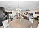 Open floorplan featuring a spacious kitchen, dining area, and living room, perfect for entertaining at 1694 E Mia Ln, Gilbert, AZ 85298