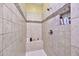 Walk-in shower features tile surround and built-in bench at 1694 E Mia Ln, Gilbert, AZ 85298