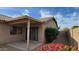 Backyard patio with desert landscaping, plants, and covered patio area for relaxing at 17151 W Mohave St, Goodyear, AZ 85338