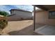 This backyard features a stone landscape, block wall, and patio view of the house at 17151 W Mohave St, Goodyear, AZ 85338