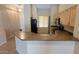 Another view of the kitchen showing the breakfast bar, appliances, and ample counter space at 17151 W Mohave St, Goodyear, AZ 85338