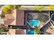 Aerial view of the home showcasing a large backyard with pool, desert landscaping and mature trees with terra cotta roof at 2218 E Desert Trumpet Rd, Phoenix, AZ 85048