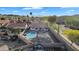 Aerial view of the home showcasing a backyard with pool, covered patio, and desert landscaping, nestled in a desert community at 2218 E Desert Trumpet Rd, Phoenix, AZ 85048
