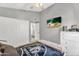 Bedroom featuring a ceiling fan, closet, and doorway to the bathroom at 2218 E Desert Trumpet Rd, Phoenix, AZ 85048