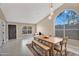 Bright dining area featuring neutral walls, unique lighting fixture, and arching window with desert views at 2218 E Desert Trumpet Rd, Phoenix, AZ 85048