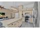 Spacious open-concept kitchen features an island with seating and a range with stainless steel hood at 2218 E Desert Trumpet Rd, Phoenix, AZ 85048