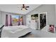 Spacious main bedroom featuring a walk-in closet, TV and a view of the outdoor pool at 2218 E Desert Trumpet Rd, Phoenix, AZ 85048
