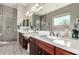 Bathroom featuring double vanity with white countertop and tiled walk-in shower at 22434 S 226Th Pl, Queen Creek, AZ 85142
