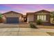 Charming single-story home with stone accents, desert landscaping, and a welcoming front entrance at 22434 S 226Th Pl, Queen Creek, AZ 85142