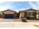 Charming single-Gathering home featuring stone accents, neutral tones, and a two-car garage at 22434 S 226Th Pl, Queen Creek, AZ 85142