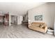 Bright and airy living room with light-colored tile flooring and views of other living spaces at 22434 S 226Th Pl, Queen Creek, AZ 85142