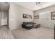 Cozy entertainment room with stylish gray sofa and modern decor at 22434 S 226Th Pl, Queen Creek, AZ 85142