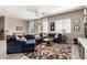 Living room with light gray walls, tile flooring and a modern colorful rug at 22434 S 226Th Pl, Queen Creek, AZ 85142