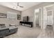Bright living area with sectional sofa, TV, and tiled entryway at 22434 S 226Th Pl, Queen Creek, AZ 85142