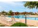 Community pool with multiple chairs and shade at 22434 S 226Th Pl, Queen Creek, AZ 85142