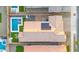 Aerial view of a home featuring a swimming pool, solar panels, and a well-kept yard at 22473 E Twilight Dr, Queen Creek, AZ 85142