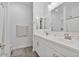Modern bathroom with double vanity, neutral accents, and ample lighting at 22473 E Twilight Dr, Queen Creek, AZ 85142