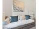 Close-up of a comfortable daybed with stylish pillows and a decorative throw at 22473 E Twilight Dr, Queen Creek, AZ 85142